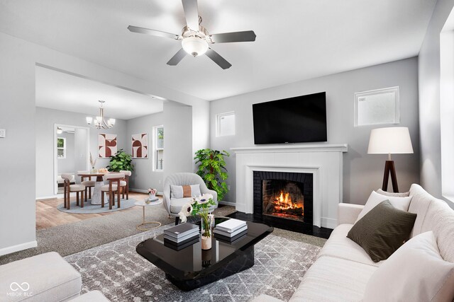 110 E Mcdonald St, Brazil, IN 47834 - living room featuring a fireplace, healthy amount of natural light, a ceiling fan, and baseboards