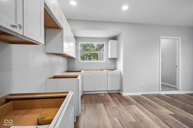 110 E Mcdonald St, Brazil, IN 47834 - kitchen featuring light wood-type flooring, white cabinets, recessed lighting, and baseboards