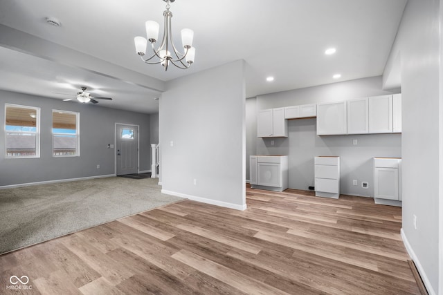 110 E Mcdonald St, Brazil, IN 47834 - unfurnished living room with ceiling fan, baseboards, a chandelier, light wood-style flooring, and recessed lighting