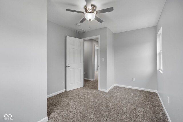 110 E Mcdonald St, Brazil, IN 47834 - unfurnished bedroom with carpet, baseboards, and a ceiling fan