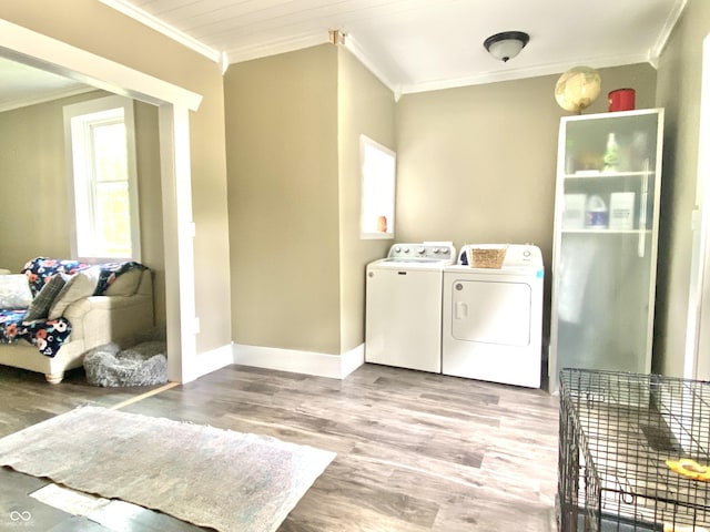 725 E Washington St, Greencastle, IN 46135 - washroom with ornamental molding, independent washer and dryer, and wood finished floors