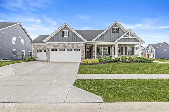 1107 Mccray Ln, Westfield, IN 46074 - craftsman-style home with board and batten siding, a front lawn, a porch, and an attached garage