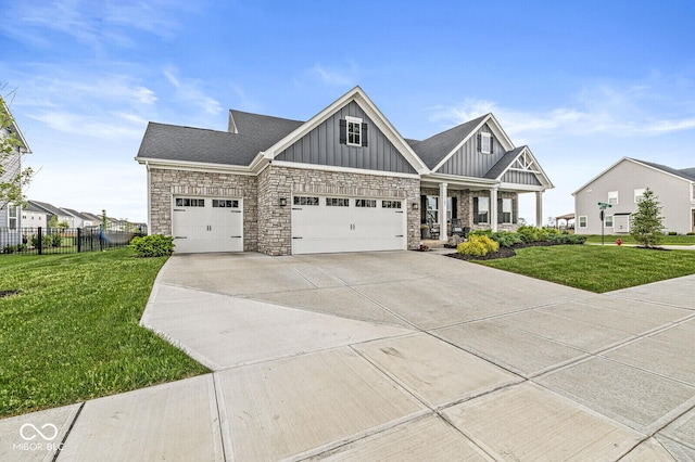 1107 Mccray Ln, Westfield, IN 46074 - craftsman-style home with board and batten siding, concrete driveway, a porch, an attached garage, and stone siding