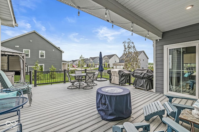 1107 Mccray Ln, Westfield, IN 46074 - wooden deck featuring outdoor dining area, a residential view, and area for grilling