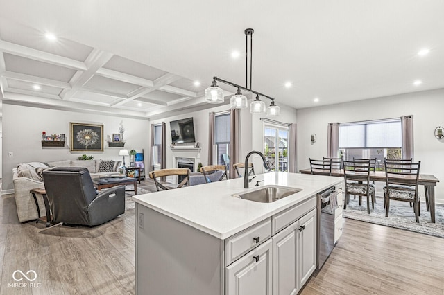 1107 Mccray Ln, Westfield, IN 46074 - kitchen with a sink, open floor plan, recessed lighting, light wood-type flooring, and light countertops