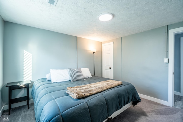 1631 Columbia Ave, Indianapolis, IN 46202 - carpeted bedroom with baseboards and a textured ceiling