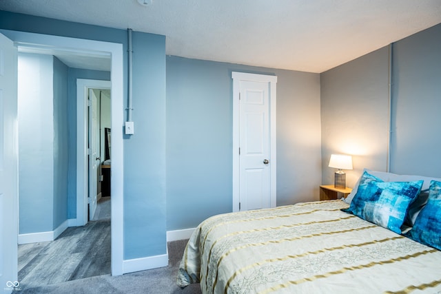 1631 Columbia Ave, Indianapolis, IN 46202 - bedroom featuring baseboards and wood finished floors