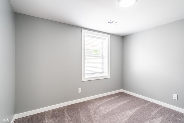 1631 Columbia Ave, Indianapolis, IN 46202 - carpeted empty room with baseboards