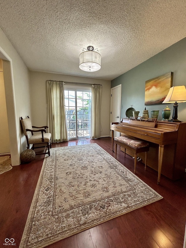 5491 Vin Rose Ln, Lawrence, IN 46226 - living area featuring a textured ceiling and dark wood finished floors