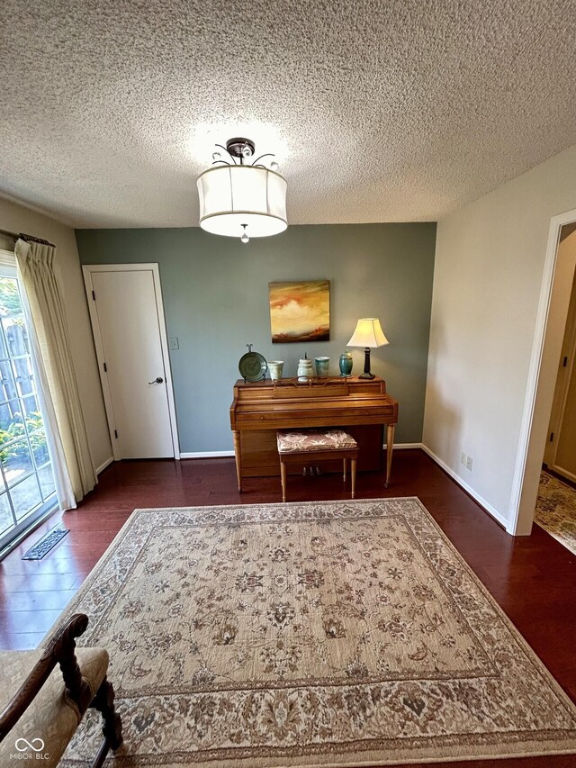 5491 Vin Rose Ln, Lawrence, IN 46226 - dining room with wood finished floors, a textured ceiling, and baseboards