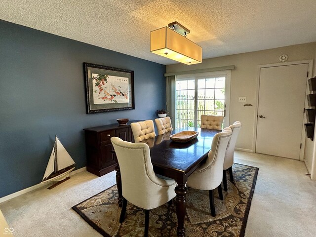 5491 Vin Rose Ln, Lawrence, IN 46226 - dining room featuring light carpet, a textured ceiling, and baseboards