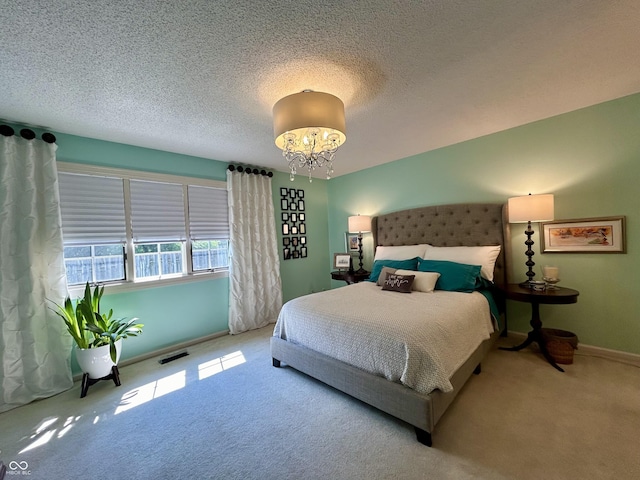 5491 Vin Rose Ln, Lawrence, IN 46226 - bedroom with carpet flooring, a chandelier, baseboards, and a textured ceiling