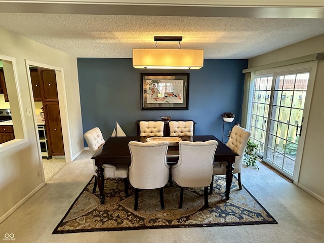 5491 Vin Rose Ln, Lawrence, IN 46226 - dining area with a textured ceiling, carpet flooring, and baseboards