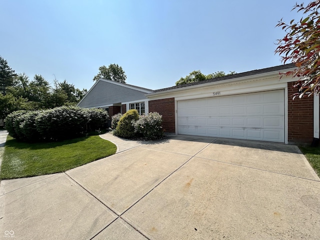 5491 Vin Rose Ln, Lawrence, IN 46226 - single story home featuring brick siding, concrete driveway, and a garage