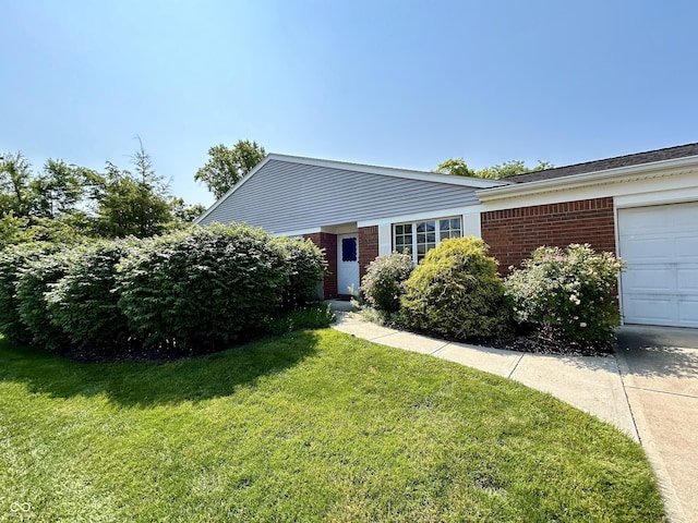 5491 Vin Rose Ln, Lawrence, IN 46226 - ranch-style house featuring brick siding, a front lawn, and a garage