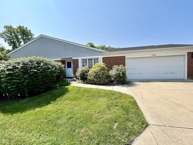 5491 Vin Rose Ln, Lawrence, IN 46226 - ranch-style house featuring brick siding, a garage, driveway, and a front lawn