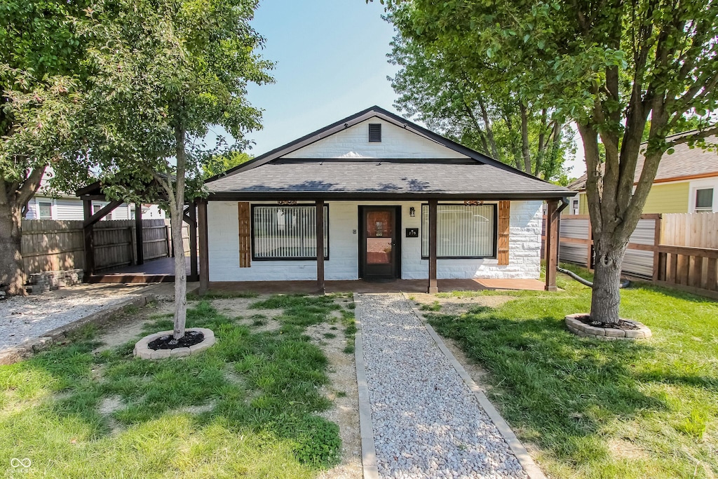 110 Highland Ave, Franklin, IN 46131 - view of front of house featuring a shingled roof and a porch