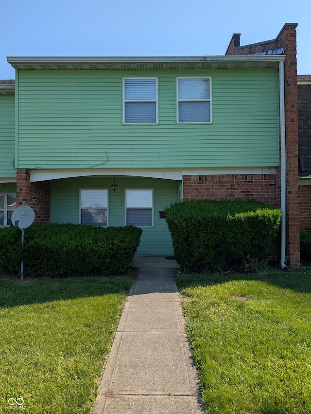 6322 Commons Dr, Indianapolis, IN 46254 - view of front of house with a front lawn and brick siding