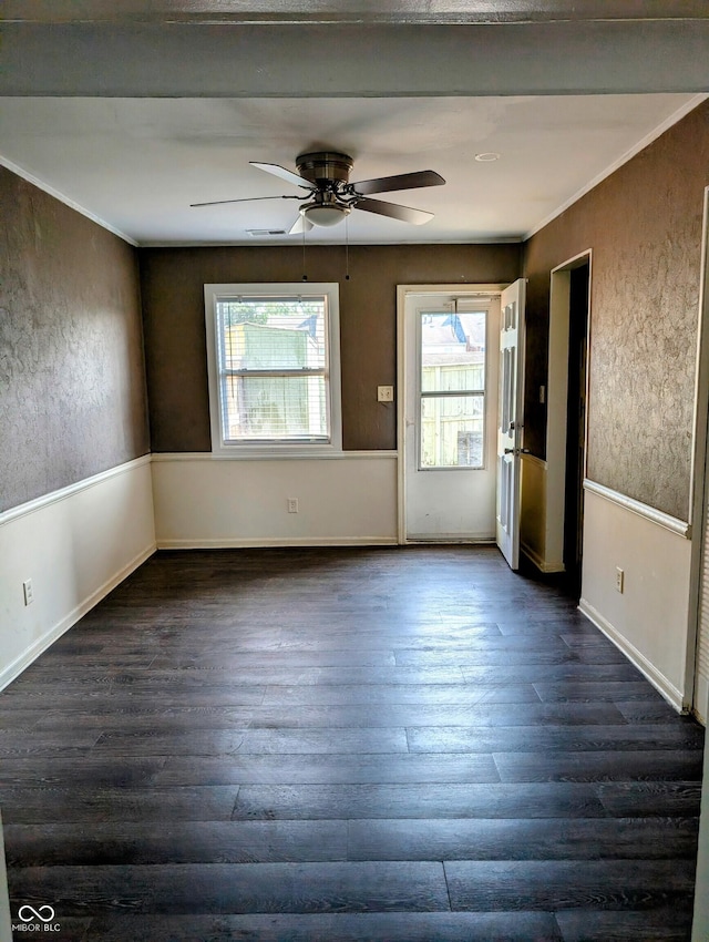 6322 Commons Dr, Indianapolis, IN 46254 - spare room with dark wood finished floors, ceiling fan, baseboards, and ornamental molding