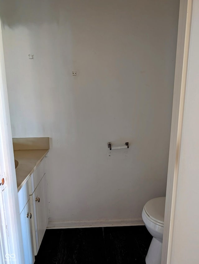 6322 Commons Dr, Indianapolis, IN 46254 - half bath with vanity, toilet, and baseboards