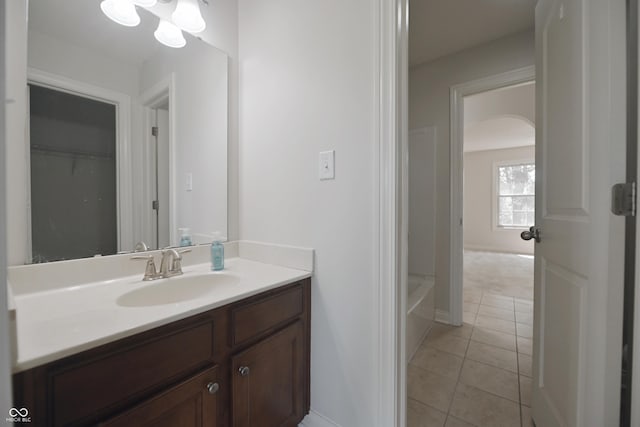 15201 Slateford Rd, Noblesville, IN 46062 - full bath featuring vanity, tile patterned flooring, a tub to relax in, and baseboards