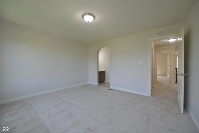 15201 Slateford Rd, Noblesville, IN 46062 - unfurnished room featuring arched walkways, light carpet, and baseboards