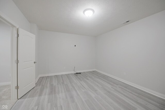 15201 Slateford Rd, Noblesville, IN 46062 - unfurnished room with light wood-style flooring, a textured ceiling, and baseboards
