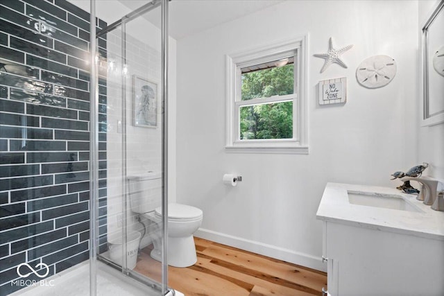 3459 E 650 N, Windfall, IN 46076 - bathroom featuring vanity, a stall shower, and wood finished floors