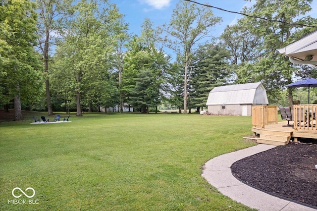 3459 E 650 N, Windfall, IN 46076 - view of grassy yard with a deck and an outdoor structure