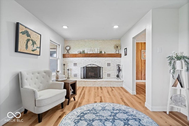 3459 E 650 N, Windfall, IN 46076 - living area with wood finished floors, a brick fireplace, and recessed lighting