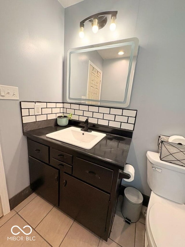 8990 N 850 W, Fairland, IN 46126 - half bathroom featuring toilet, vanity, decorative backsplash, tile patterned flooring, and baseboards