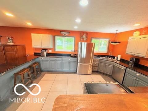 8990 N 850 W, Fairland, IN 46126 - kitchen featuring appliances with stainless steel finishes, gray cabinets, a sink, recessed lighting, and light tile patterned floors