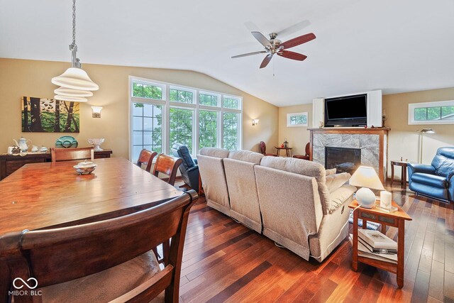 8818 N 1132 W, Monticello, IN 47960 - living area featuring vaulted ceiling, dark wood-type flooring, ceiling fan, and a high end fireplace