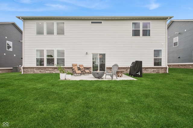 19652 Shadow Trace Path, Westfield, IN 46074 - rear view of house featuring a patio, central AC, a lawn, and brick siding