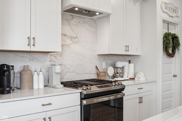 19652 Shadow Trace Path, Westfield, IN 46074 - kitchen featuring stainless steel range with gas cooktop, backsplash, white cabinetry, custom exhaust hood, and light countertops