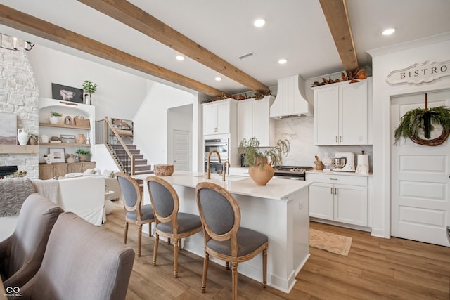 19652 Shadow Trace Path, Westfield, IN 46074 - kitchen featuring premium range hood, beam ceiling, backsplash, a sink, and open floor plan