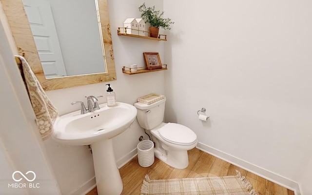 19652 Shadow Trace Path, Westfield, IN 46074 - bathroom with wood finished floors, baseboards, and toilet