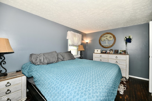 1445 Biloxi Ln, Beech Grove, IN 46107 - bedroom featuring a textured ceiling and dark wood-style flooring