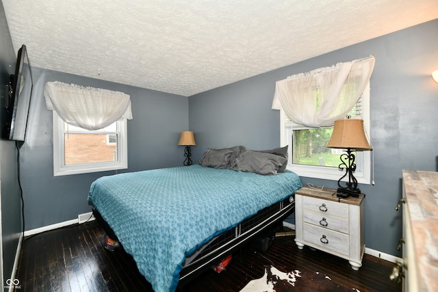 1445 Biloxi Ln, Beech Grove, IN 46107 - bedroom with hardwood / wood-style flooring and a textured ceiling