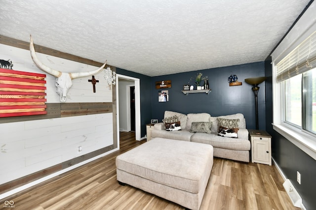 1445 Biloxi Ln, Beech Grove, IN 46107 - living area featuring wood finished floors and a textured ceiling