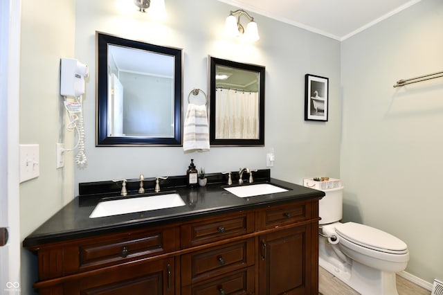 7242 Highburry Dr, Indianapolis, IN 46256 - full bath featuring double vanity, crown molding, and wood finished floors