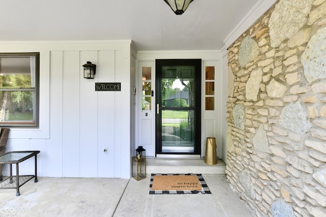7242 Highburry Dr, Indianapolis, IN 46256 - view of exterior entry featuring stone siding and board and batten siding