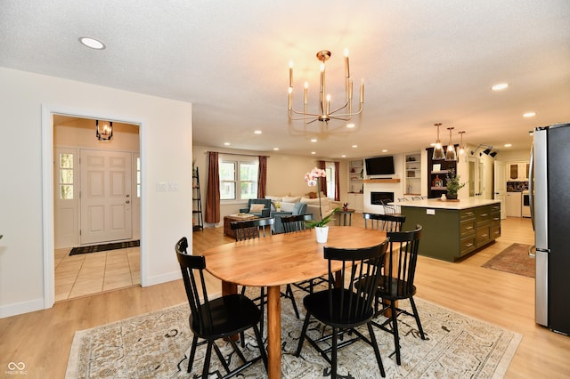 7242 Highburry Dr, Indianapolis, IN 46256 - dining area with a chandelier, light wood-style floors, and recessed lighting