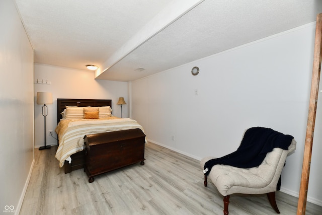 7242 Highburry Dr, Indianapolis, IN 46256 - bedroom with light wood-style flooring and a textured ceiling