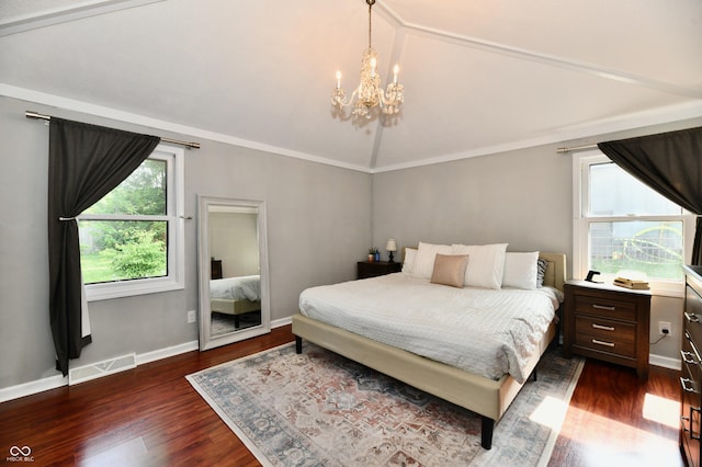 7242 Highburry Dr, Indianapolis, IN 46256 - bedroom with lofted ceiling, a chandelier, and dark wood-style floors