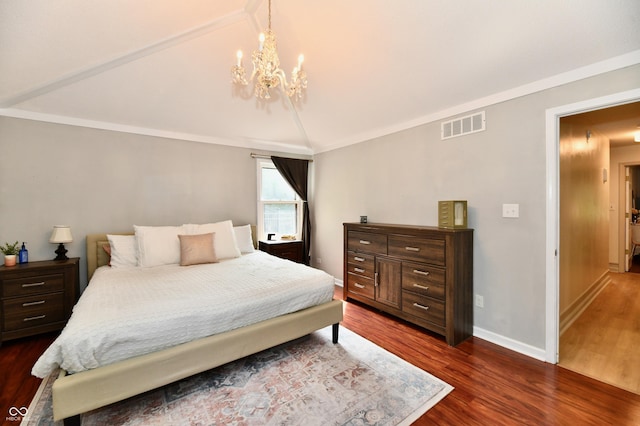 7242 Highburry Dr, Indianapolis, IN 46256 - bedroom with lofted ceiling, dark wood-style floors, and a chandelier