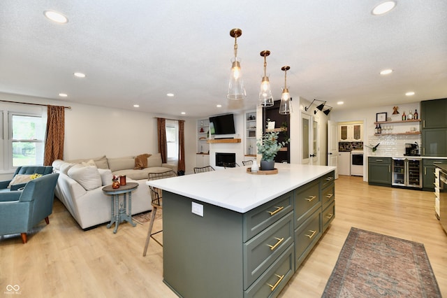7242 Highburry Dr, Indianapolis, IN 46256 - kitchen featuring open floor plan, plenty of natural light, light wood-type flooring, and recessed lighting