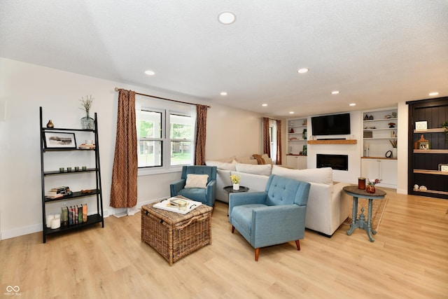7242 Highburry Dr, Indianapolis, IN 46256 - living area with light wood-style floors, a fireplace, and recessed lighting