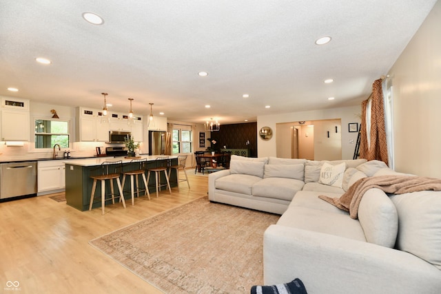 7242 Highburry Dr, Indianapolis, IN 46256 - living room featuring light wood finished floors and recessed lighting