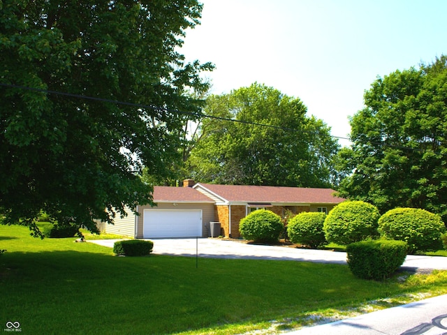 11343 E 191st St, Noblesville, IN 46060 - view of front of house with an attached garage, a front lawn, concrete driveway, and a chimney
